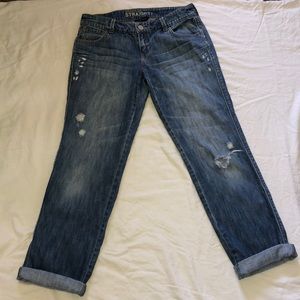 Distressed blue jeans